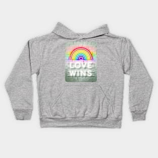 Love Wins Neon Sign on White Brick Wall Kids Hoodie